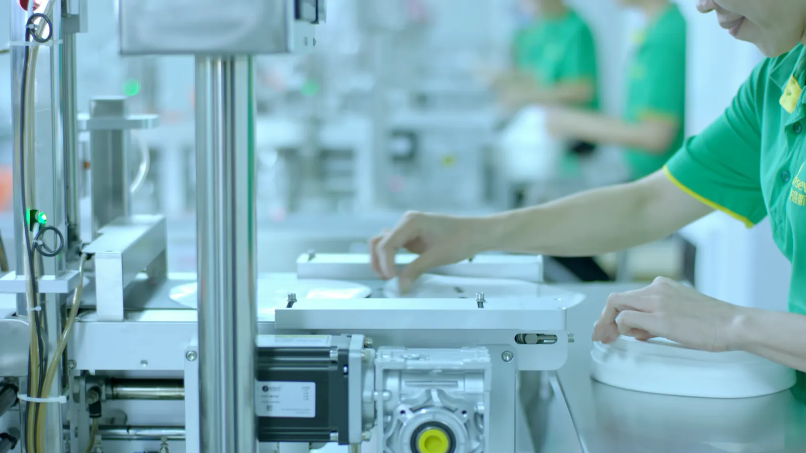 Production operator performing in-process quality control at NEXO Beauty Labs