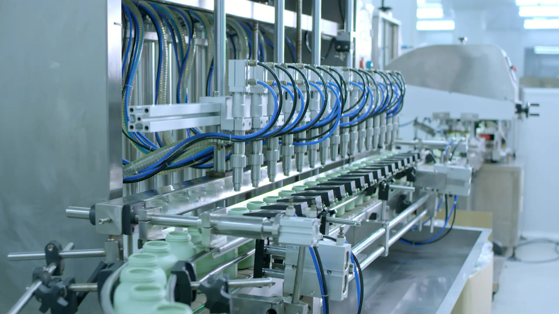 Automated filling line for cosmetic products in a clean manufacturing environment