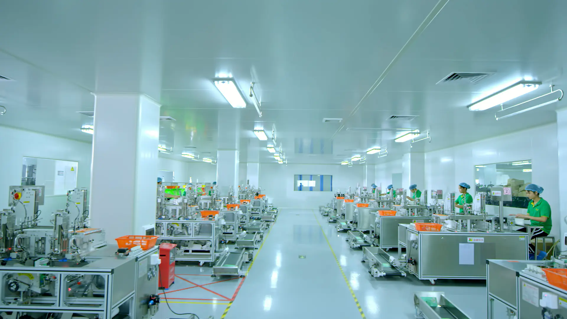 Cosmetic Cleanroom Manufacturing Floor Cleanroom cosmetic manufacturing floor with production equipment and operators
